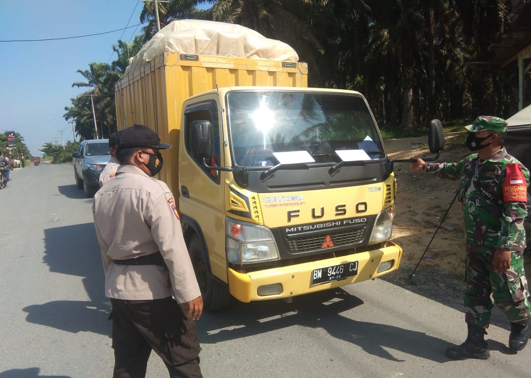 Sasar Pengendara, Polsek Kerumutan Gelar Penertiban Prokes di Pos PPKM