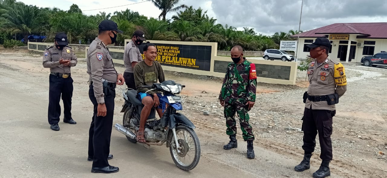 Lindungi Wilayah Binaan dari Covid-19, Polsubsektor Pelalawan Lakukan Operasi Yustisi