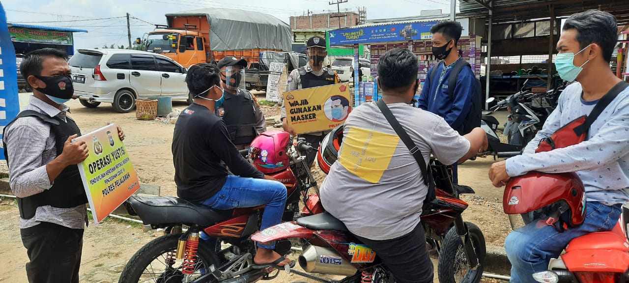 Polsek Ukui Ajak Masyarakat Disiplin Protokol Kesehatan
