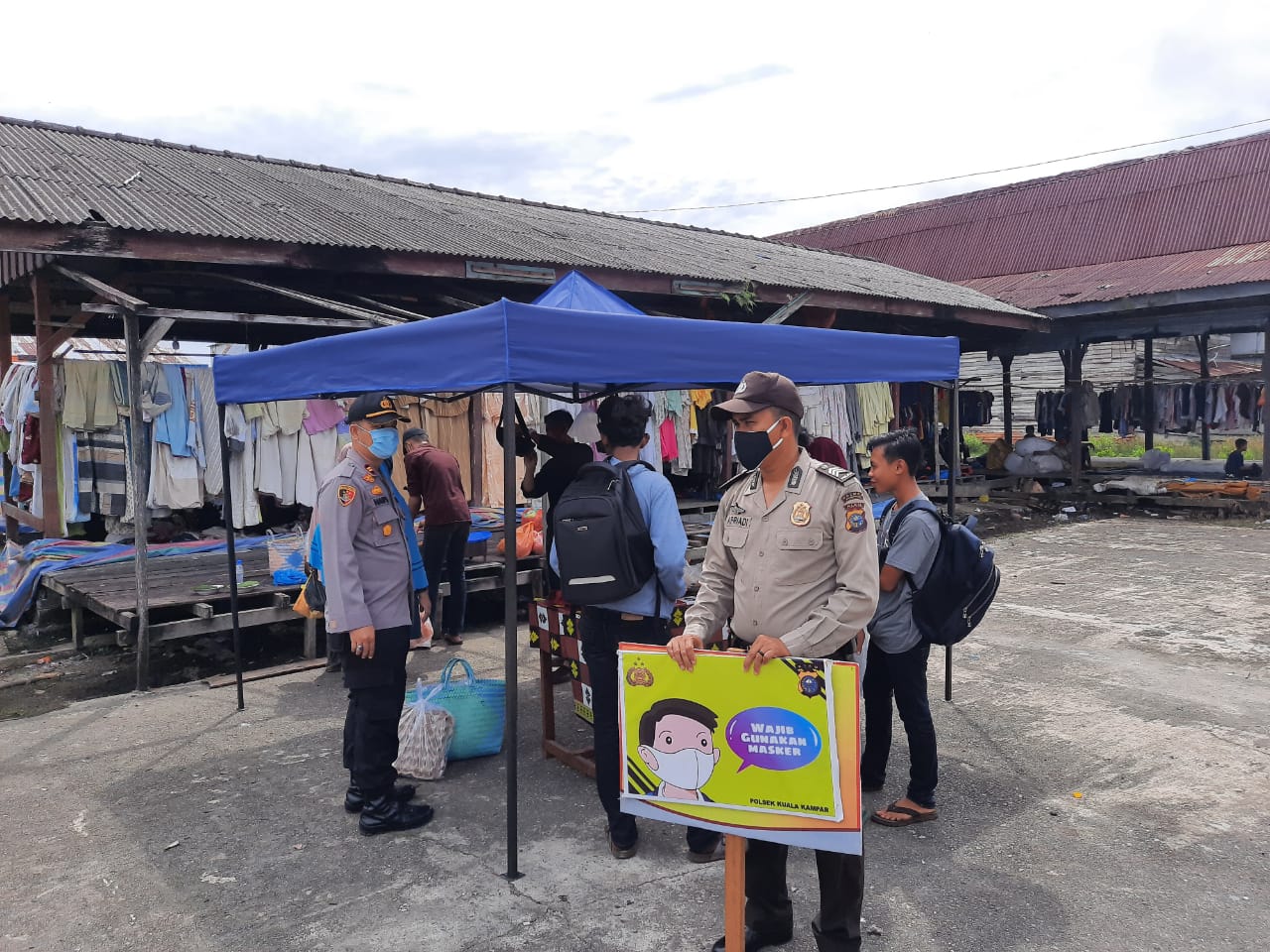 Personel Polsek Kuala Kampar Imbau Warga Terapkan Protokol Kesehatan